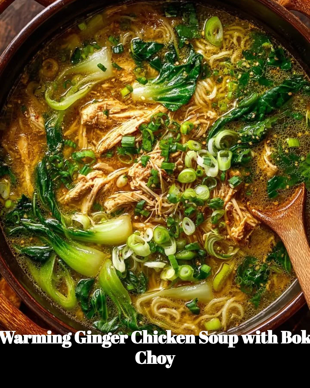Bowl of warming ginger chicken soup with bok choy and herbs