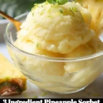 3 Ingredient Pineapple Sorbet in a bowl with fresh pineapple slices