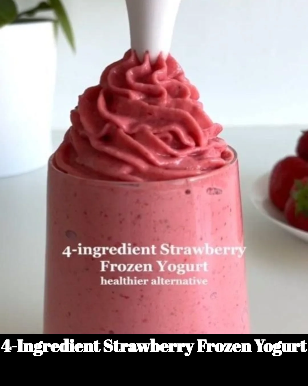 Bowl of 4-Ingredient Strawberry Frozen Yogurt topped with fresh strawberries