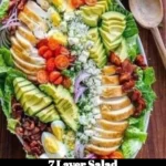 Colorful and delicious 7 Layer Salad in a glass bowl, showcasing layers of fresh ingredients.