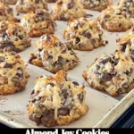 Freshly baked Almond Joy Cookies with chocolate drizzles and almonds