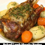 Baked lamb shanks served with vegetables on a rustic plate