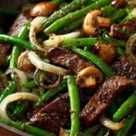 Delicious black pepper beef stir-fry with mushrooms and green beans