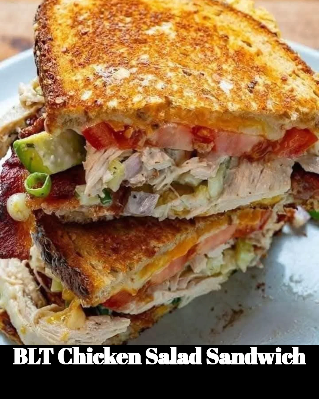 Delicious BLT chicken salad sandwich with crispy bacon, lettuce, and tomato