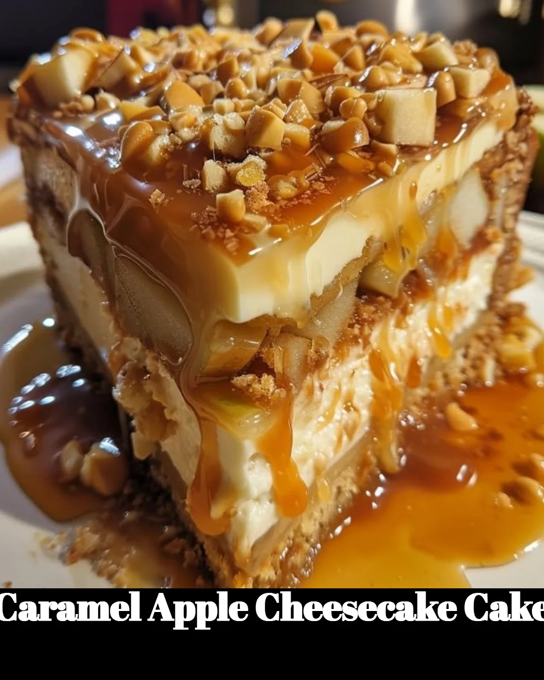 Slice of Caramel Apple Cheesecake Cake topped with caramel and apple slices.