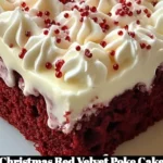 Delicious Christmas Red Velvet Poke Cake topped with cream cheese frosting
