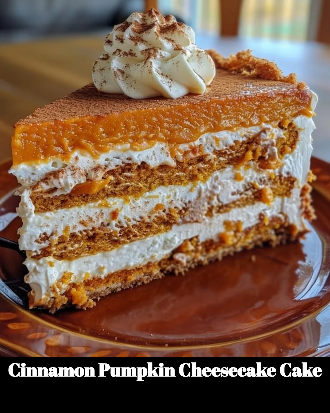 Cinnamon Pumpkin Cheesecake Cake topped with whipped cream and a cinnamon sprinkle