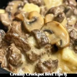 Creamy crockpot beef tips with mushrooms in a serving dish