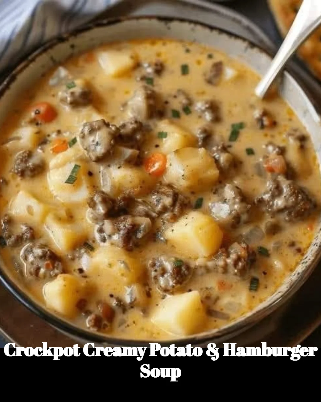 A bowl of Crockpot Creamy Potato & Hamburger Soup garnished with fresh parsley.