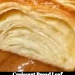 Freshly baked croissant bread loaf with a golden crust and flaky layers