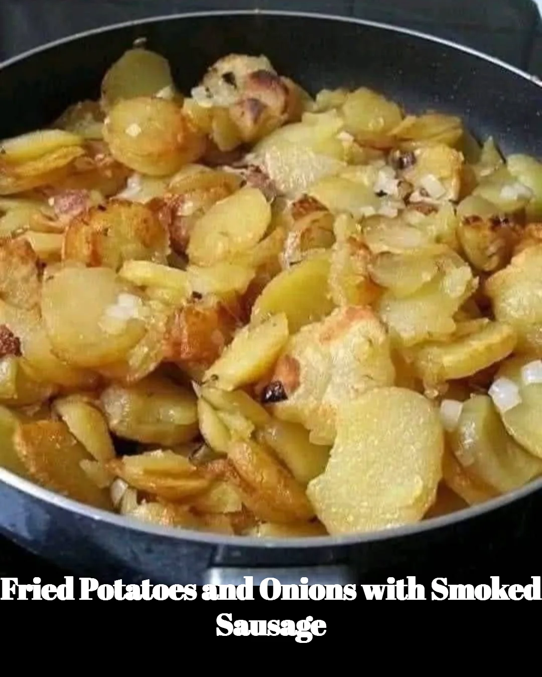 Delicious plate of fried potatoes and onions served with smoked sausage