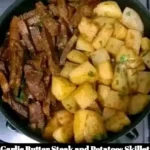 Garlic butter steak and potatoes skillet in a cast iron pan
