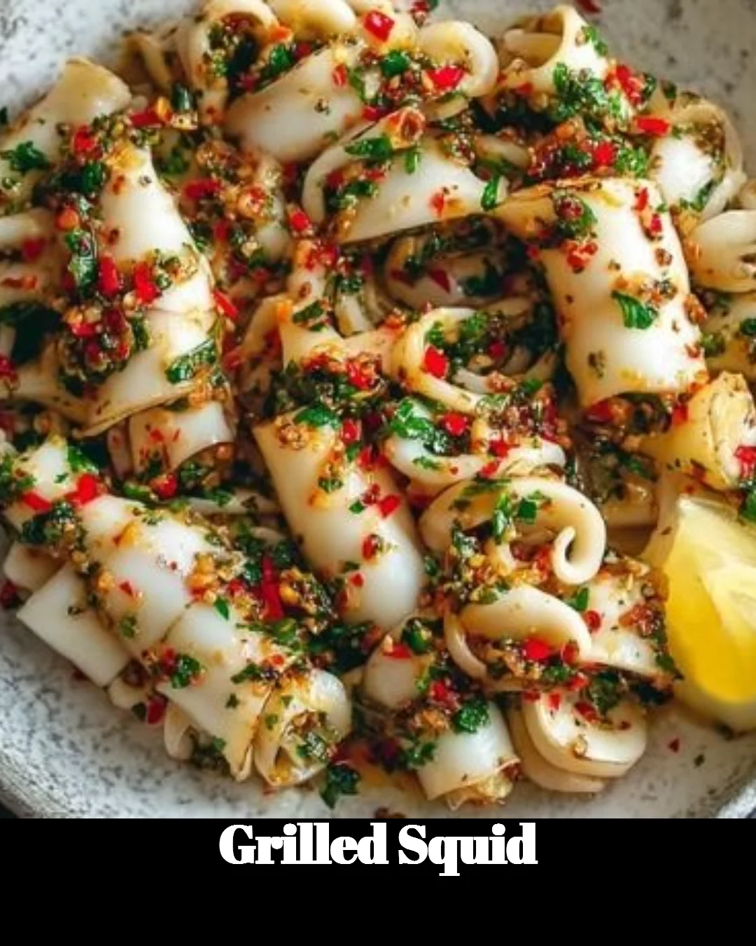 Delicious grilled squid served on a plate garnished with fresh herbs