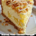Heavenly white chocolate cheesecake topped with pineapple and coconut