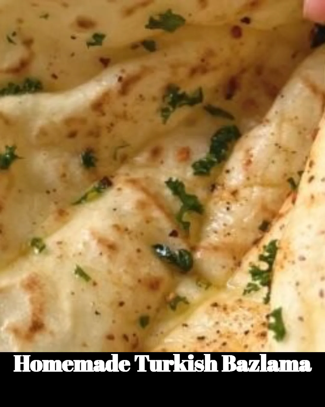 Freshly made homemade Turkish Bazlama flatbread on a wooden board