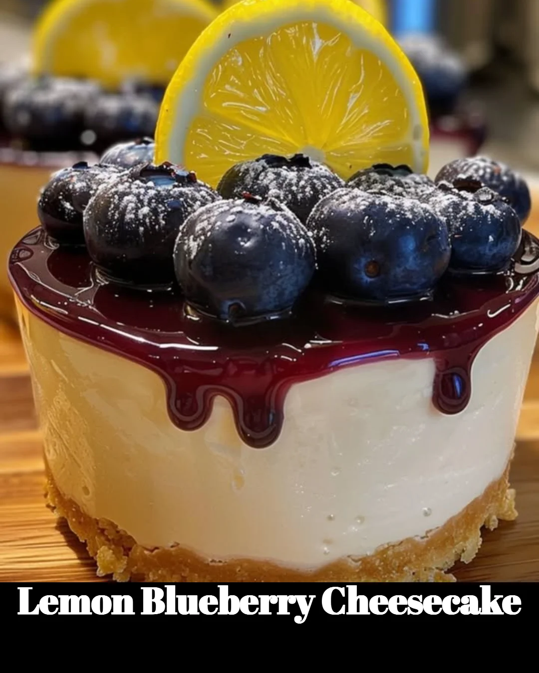 Sliced lemon blueberry cheesecake garnished with fresh blueberries and lemon zest.