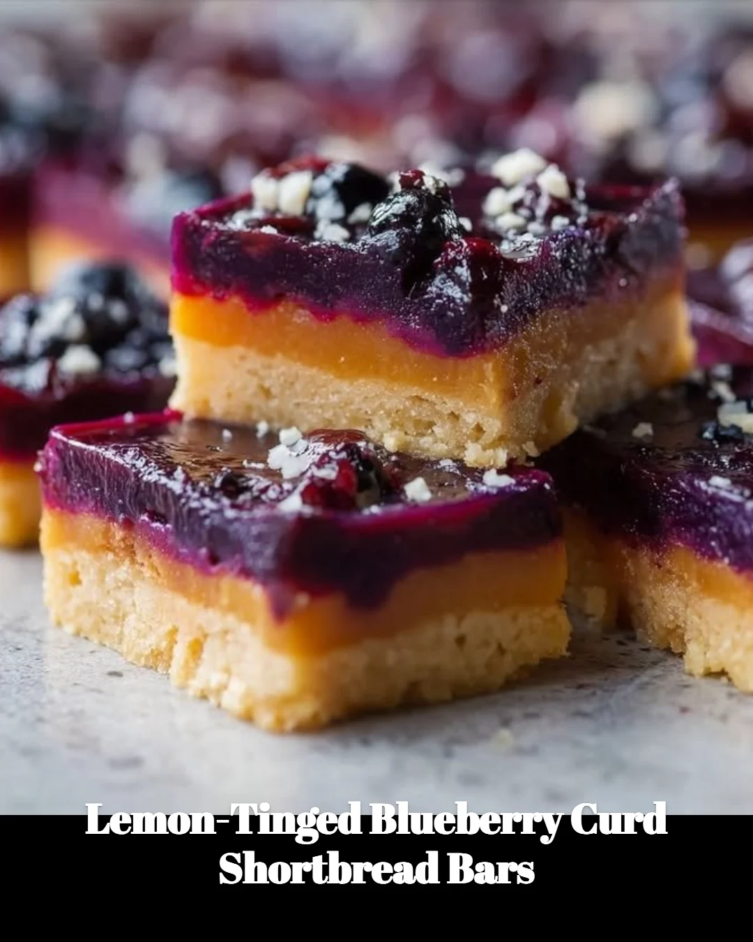 Blueberry curd shortbread bars with lemon zest on a plate