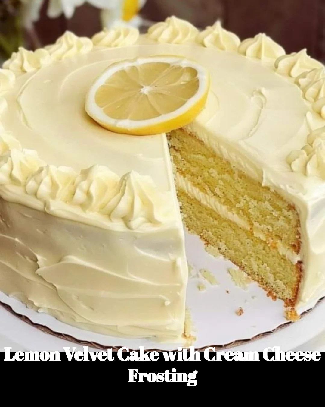Lemon Velvet Cake with Cream Cheese Frosting on a white plate