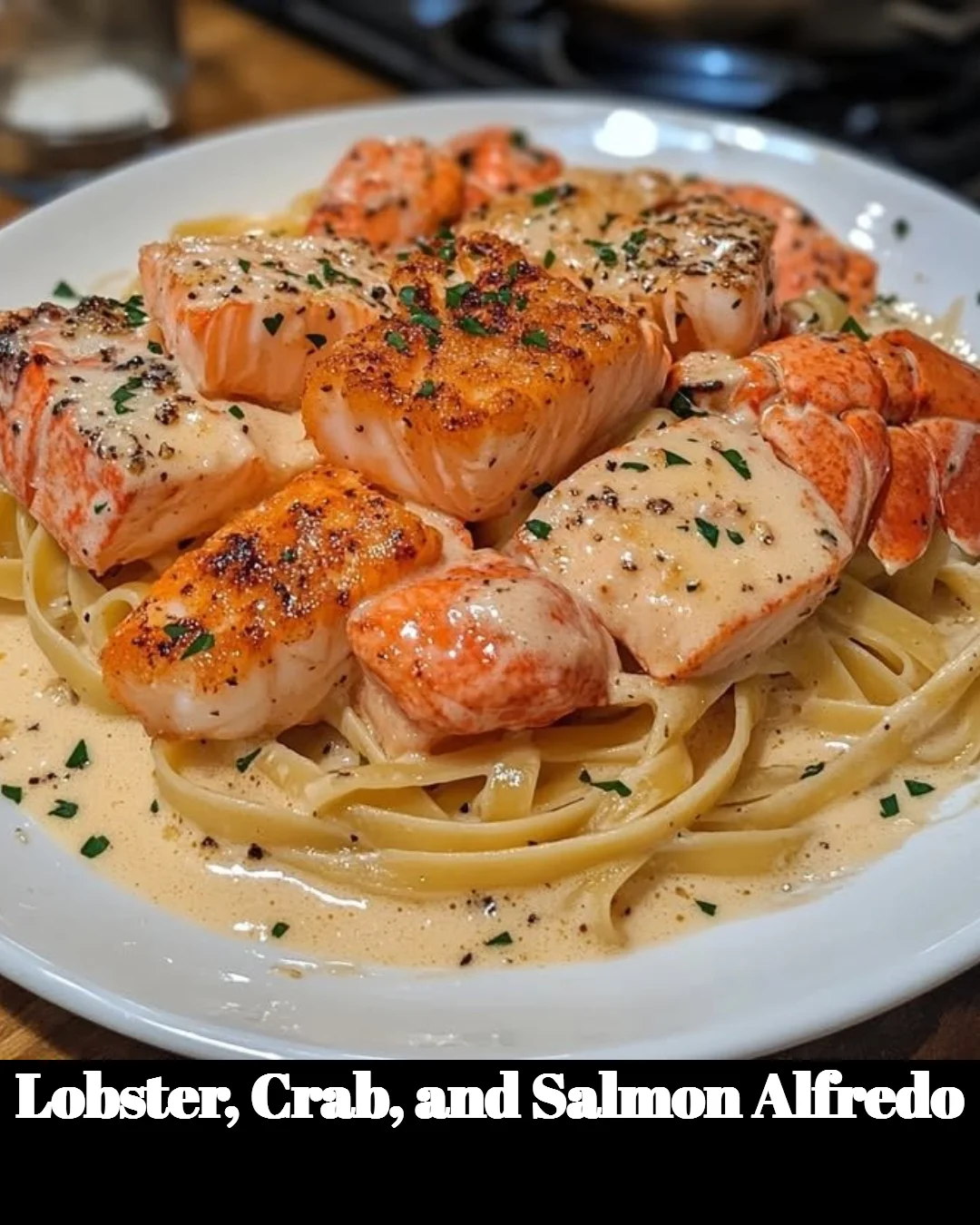 Delicious Lobster Alfredo with crab and salmon served in a creamy sauce