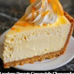 Delicious Orange Creamsicle Cheesecake topped with fresh orange slices.