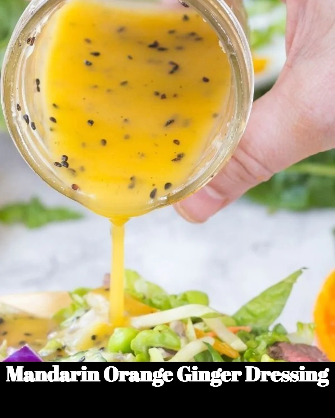 Bowl of vibrant Mandarin Orange Ginger Dressing with fresh ingredients