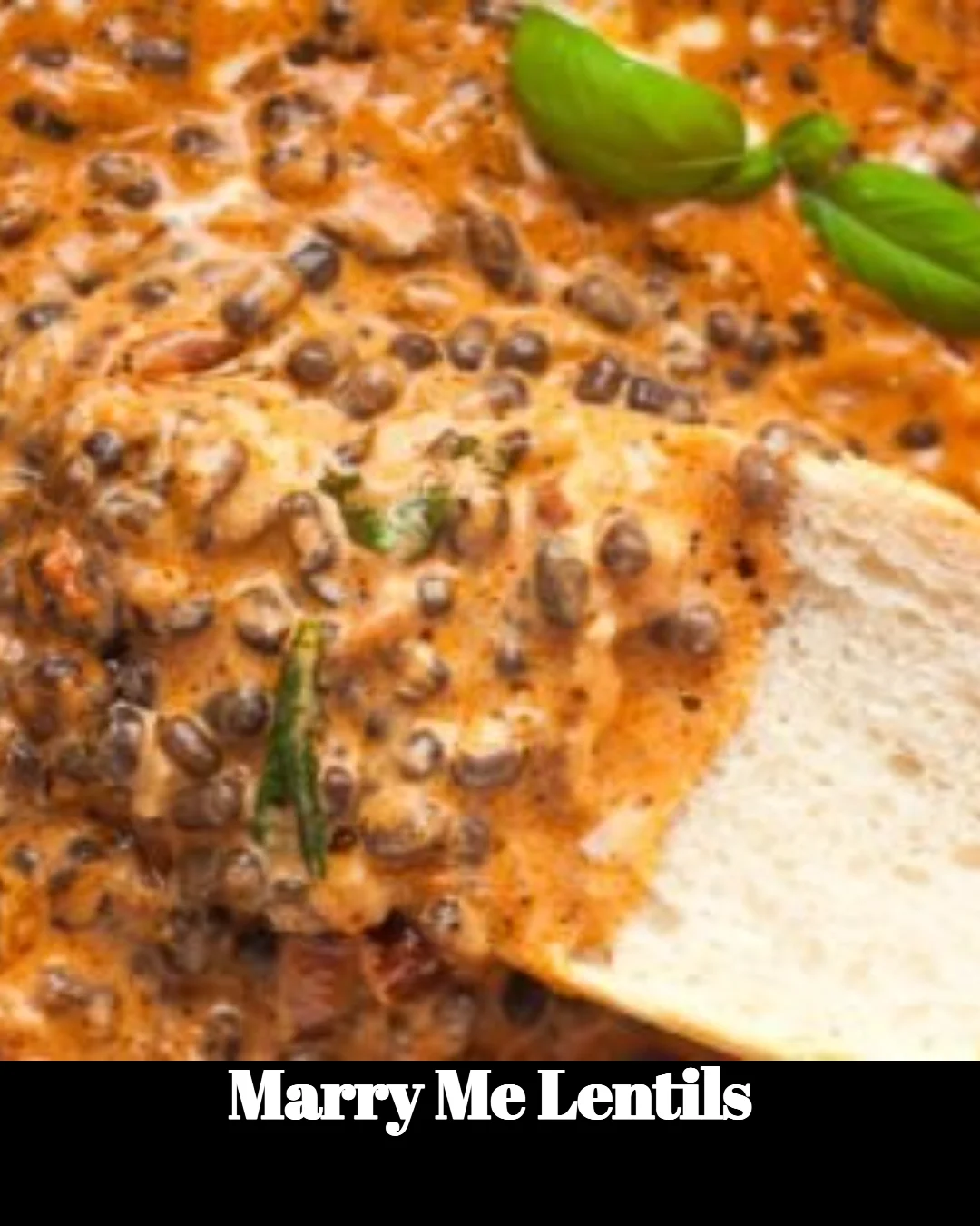 Bowl of delicious Marry Me Lentils recipe garnished with fresh herbs.