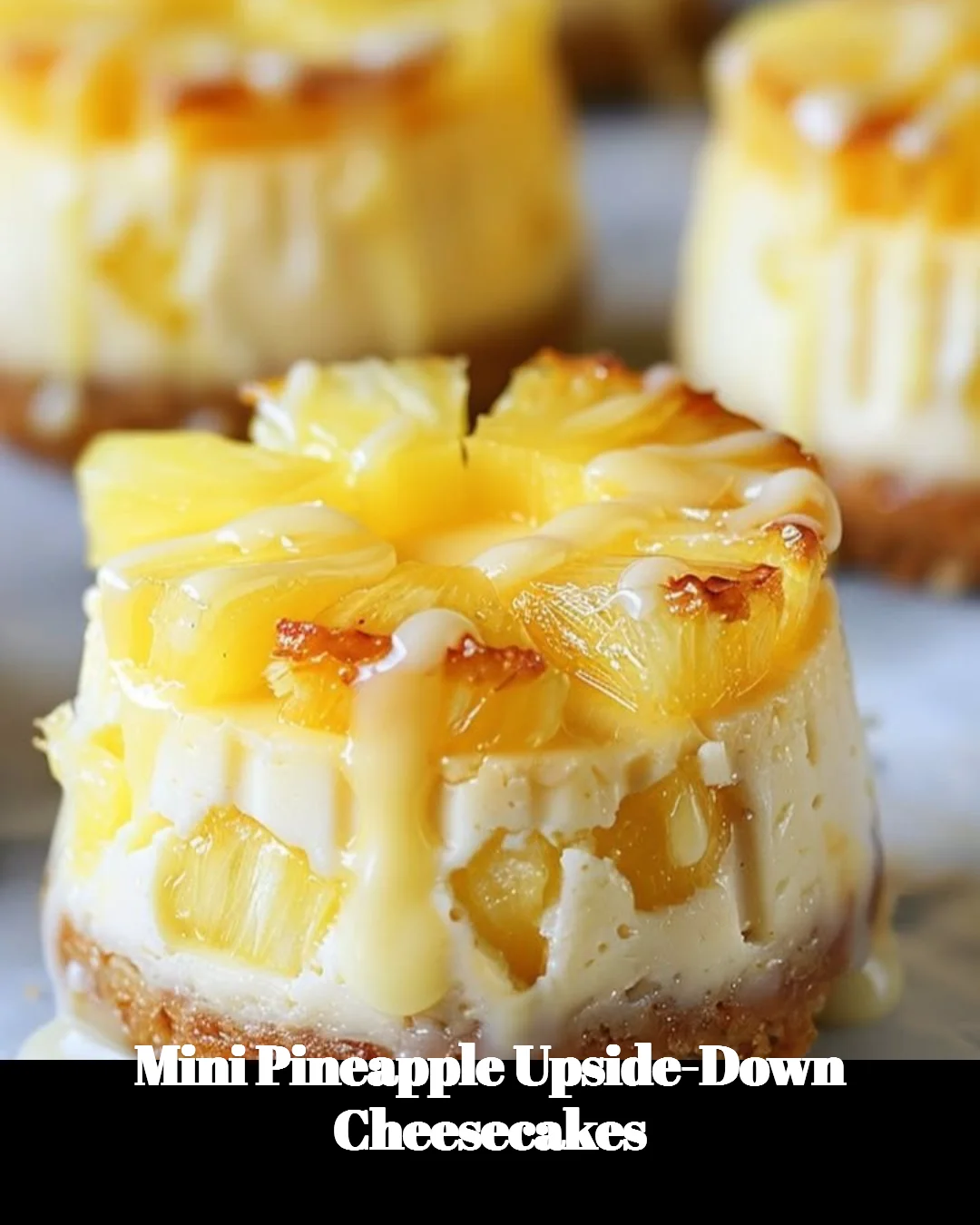 Mini Pineapple Upside-Down Cheesecakes garnished with cherries and pineapple slices