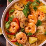 Bowl of Thai-inspired soup showcasing vibrant ingredients and aromatic herbs