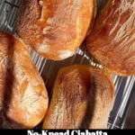 Freshly baked No-Knead Ciabatta loaf on a wooden table