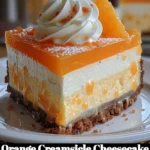 Delicious orange creamsicle cheesecake topped with vibrant orange slices.