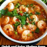 Bowl of quick and spicy shrimp soup garnished with herbs and spices
