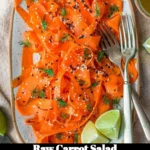 Colorful raw carrot salad with fresh vegetables and a light dressing