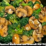 Sautéed mushroom and broccoli stir-fry served in a bowl with chopsticks.