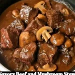 Delicious bowl of savory beef and mushroom stew garnished with herbs