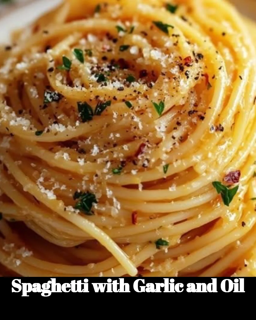 Plate of spaghetti with garlic and oil garnished with parsley