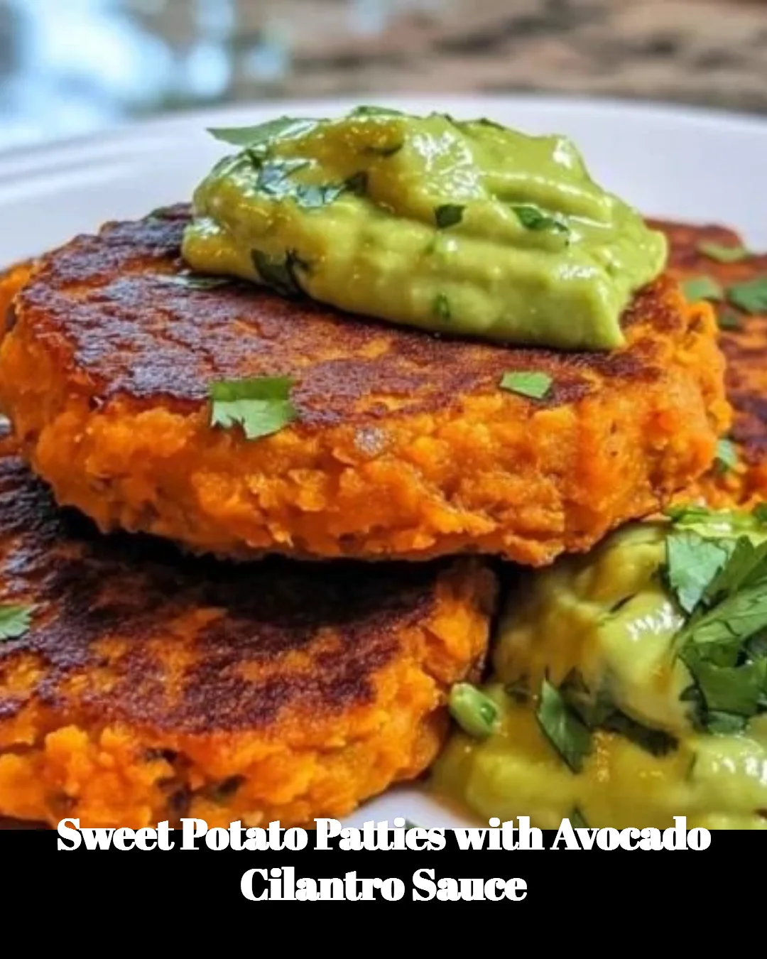 Sweet potato patties served with avocado cilantro sauce on a plate