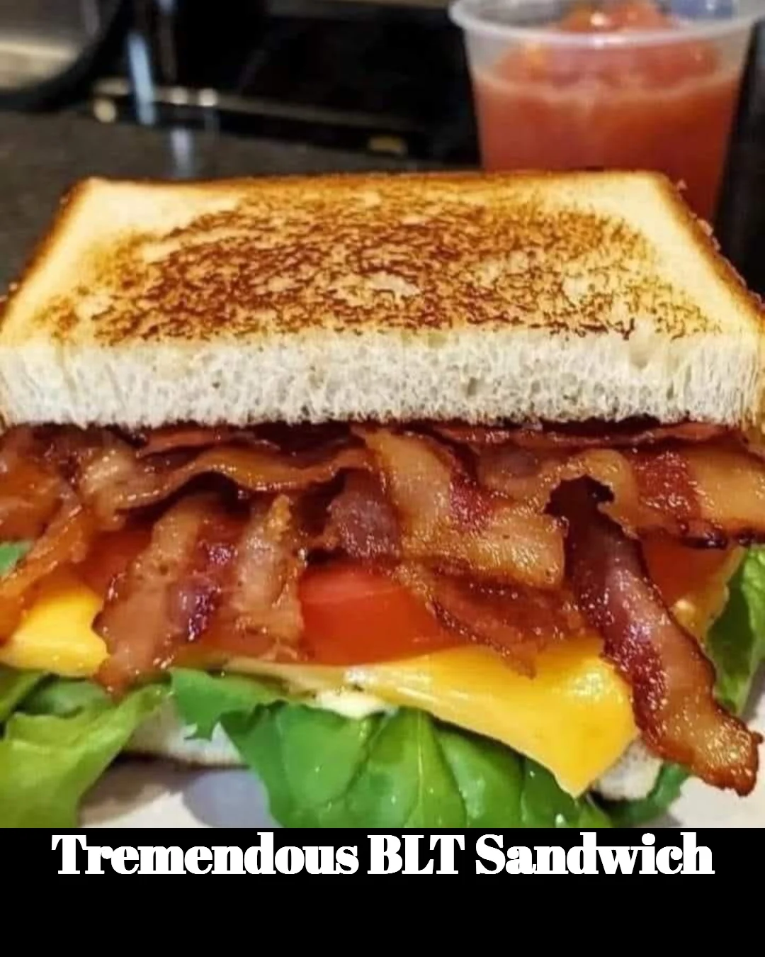 Delicious and stacked BLT sandwich with crispy bacon, lettuce, and tomatoes