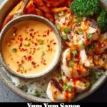 Yum Yum Sauce in a bowl with a spice sprinkle on top