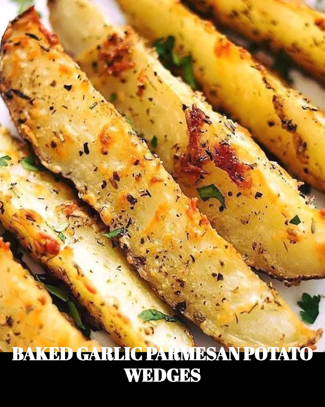 Baked garlic parmesan potato wedges topped with fresh herbs.