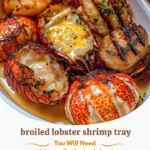 Broiled lobster tails with garlic butter and jumbo shrimp on a plate