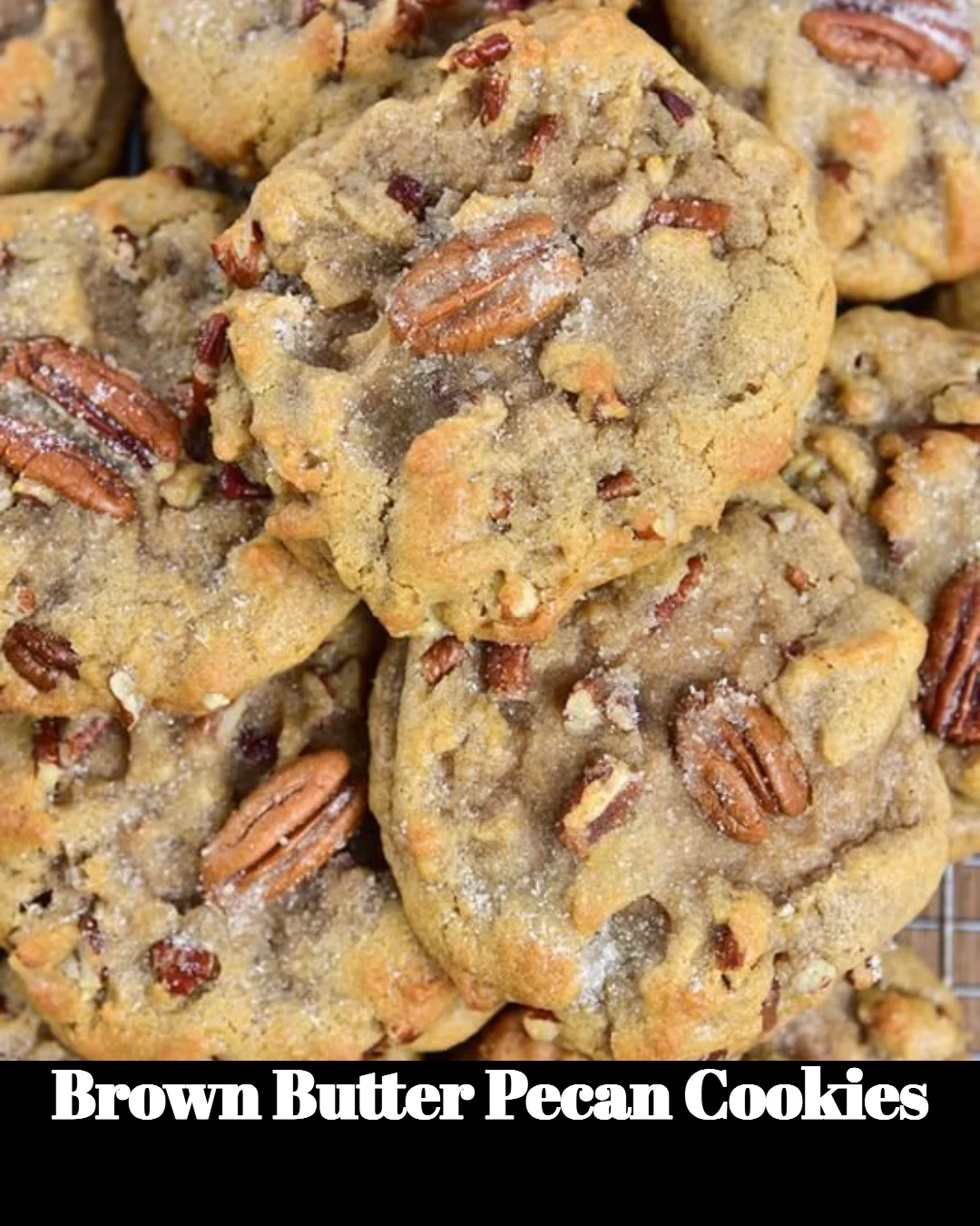 Freshly baked brown butter pecan cookies on a white plate.