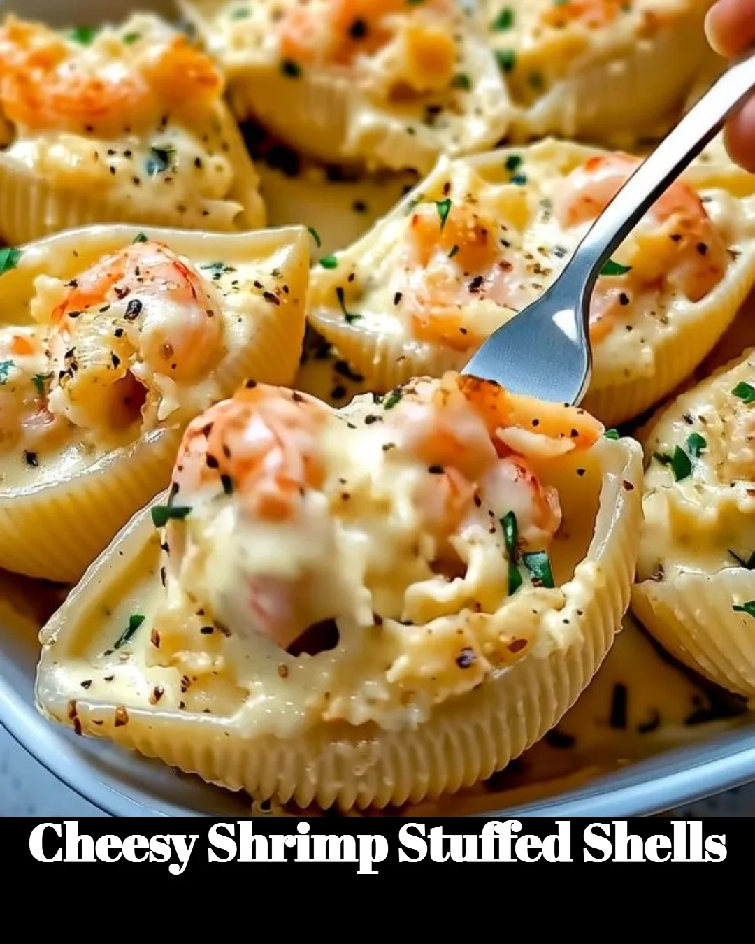 Plate of cheesy shrimp stuffed shells topped with herbs