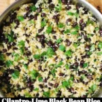 Bowl of Cilantro-Lime Black Bean Rice garnished with fresh cilantro.