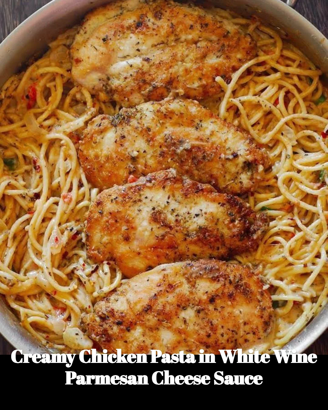 Creamy chicken pasta with white wine parmesan sauce served in a bowl