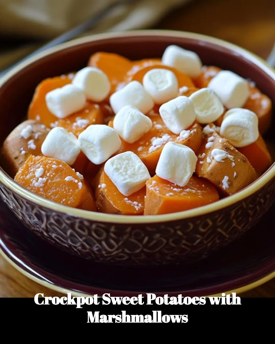 Crockpot sweet potatoes topped with marshmallows ready to serve