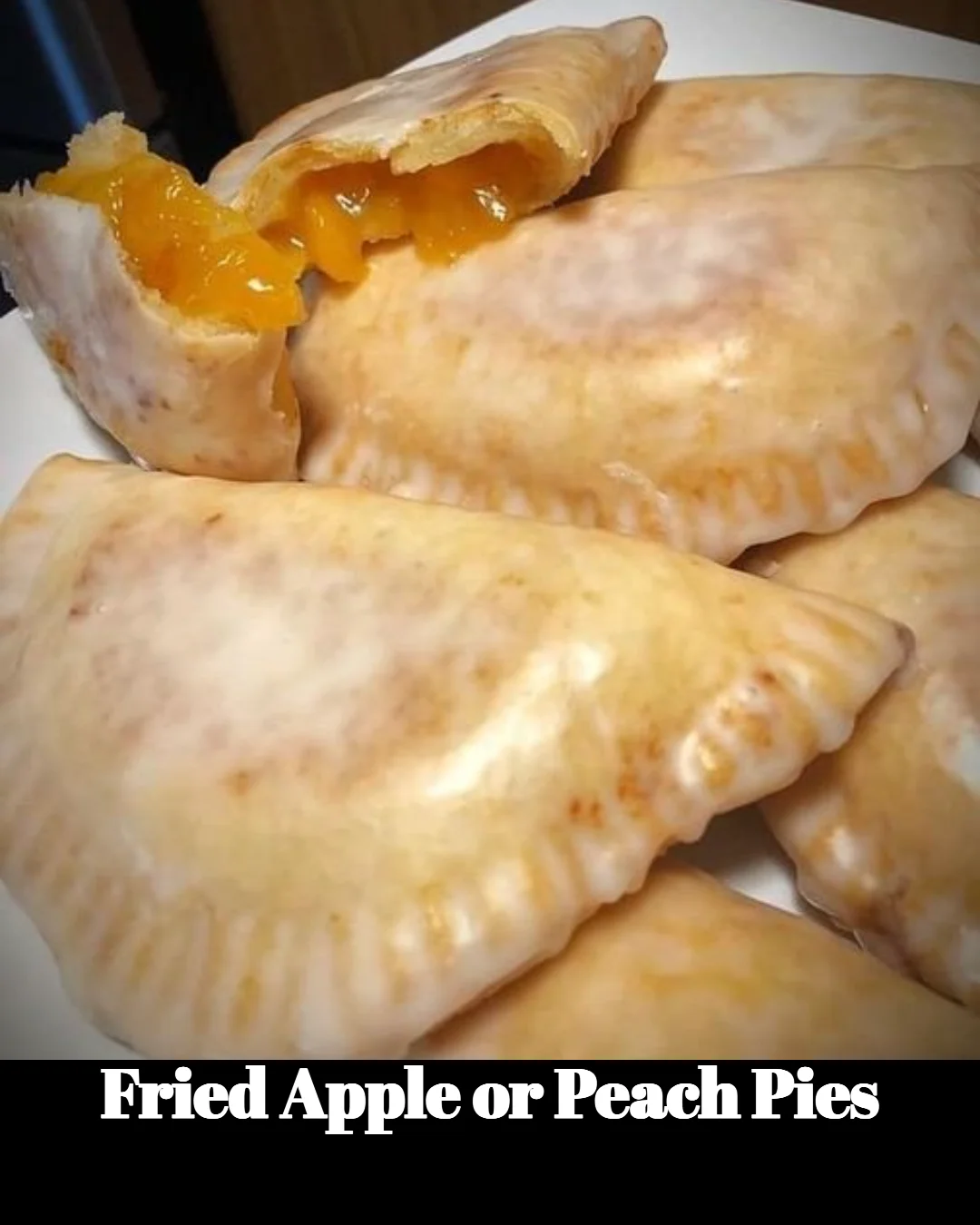 Fried apple and peach pies served on a plate, golden and crispy