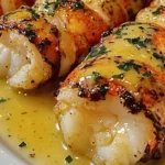 Delicious garlic butter lobster tail served with lemon and herbs