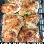 Delicious garlic parmesan chicken served on a plate with herbs