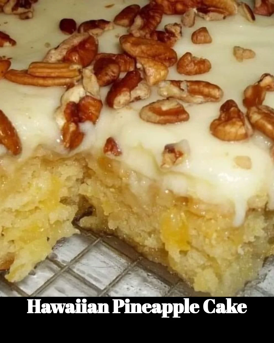 Slice of Hawaiian Pineapple Cake topped with whipped cream and fresh pineapple slices