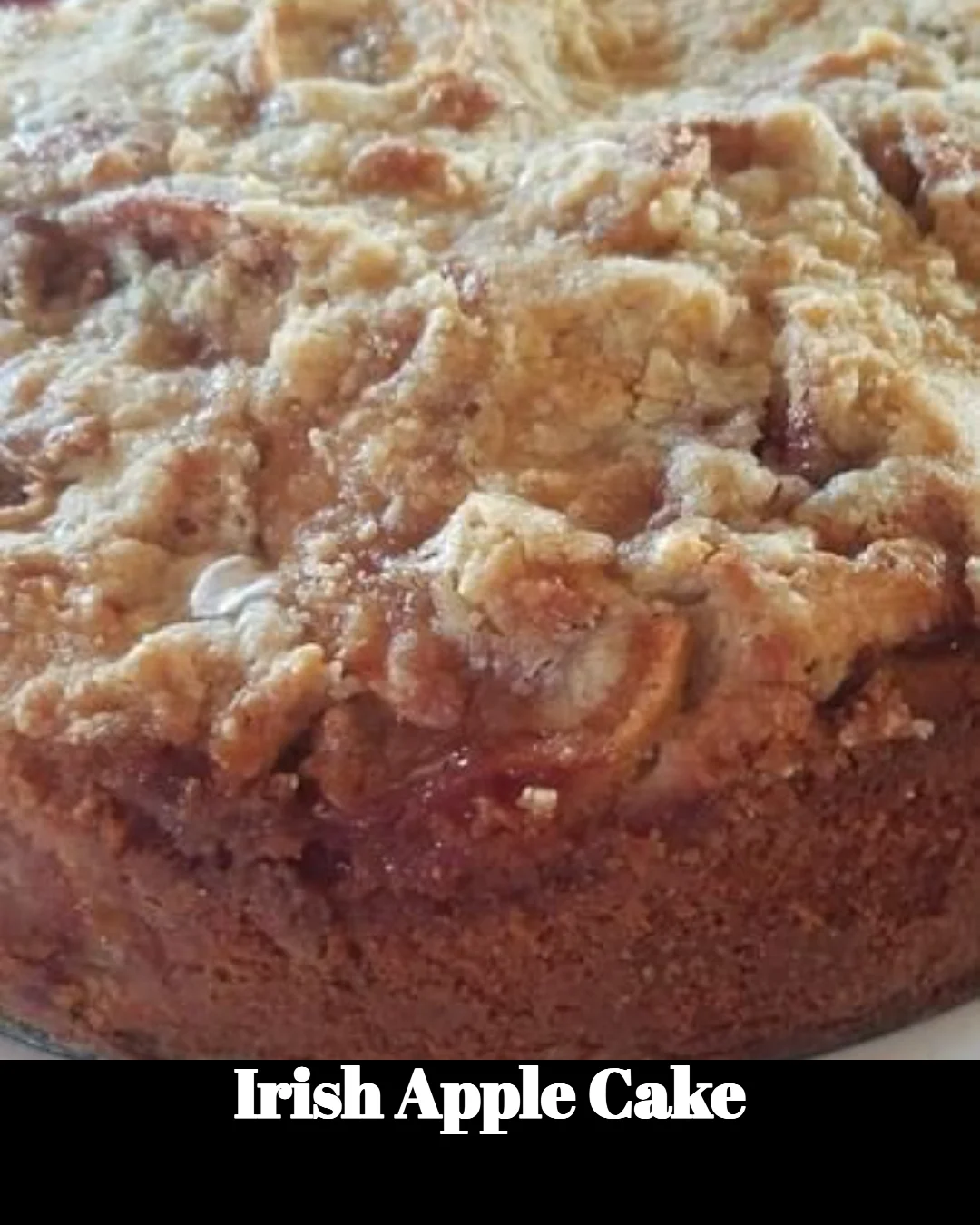 Sliced Irish Apple Cake with fresh apples and spices on a rustic table